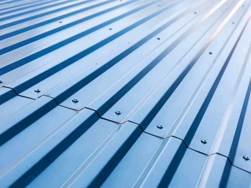 GettyImages-607593268 Blue corrugated metal roofing texture.